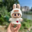chompa de corazon con gorra blanco